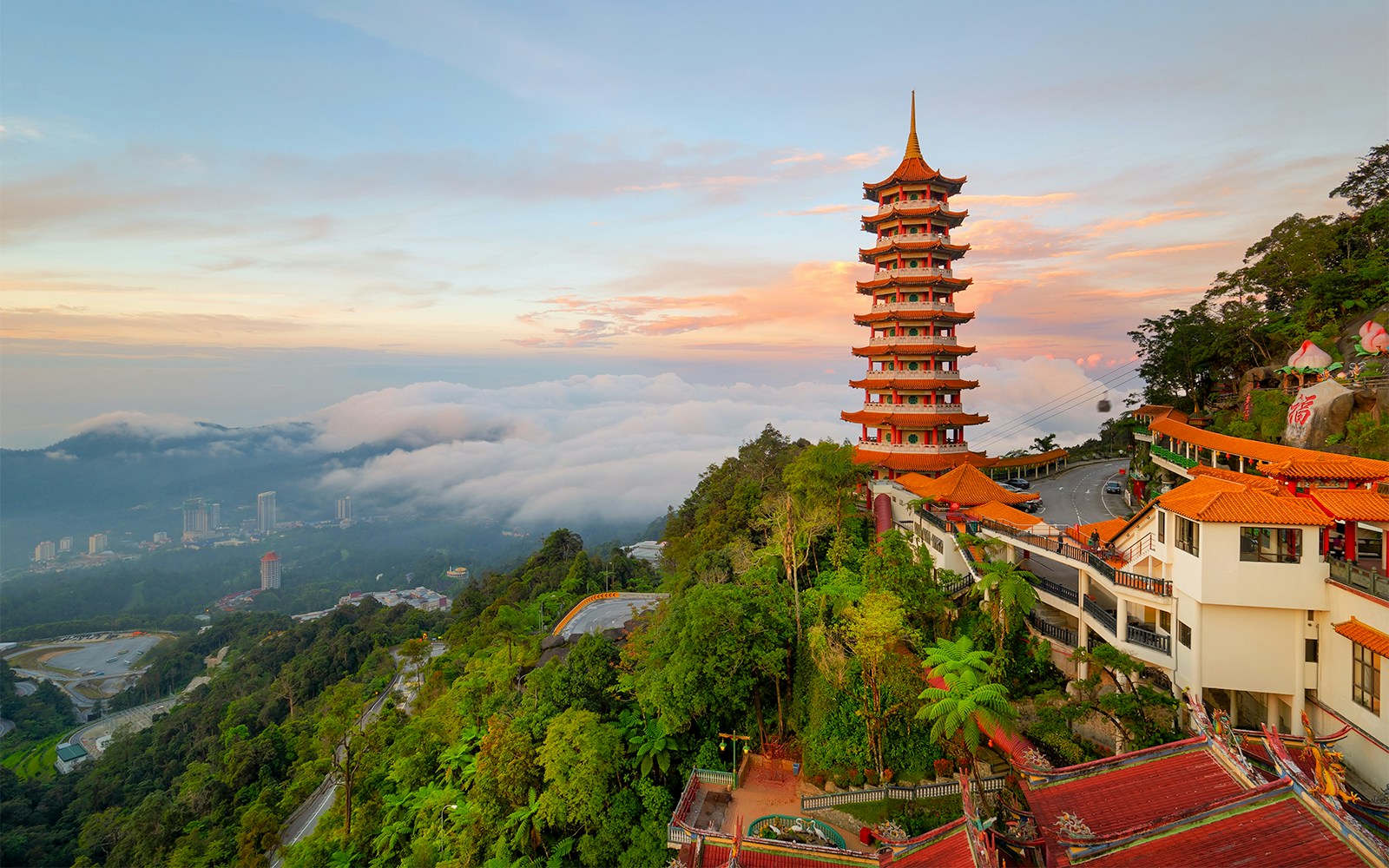 Pagoda at Chin Swee Caves Temple in Genting Highlands with misty mountain view.