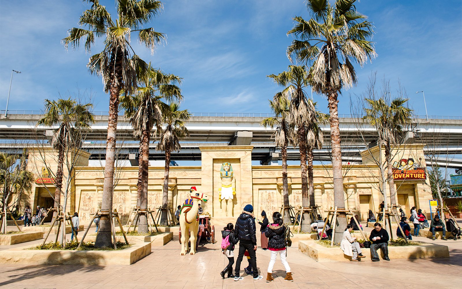 Legoland Japan entrance with Egyptian-themed decor and visitors exploring.