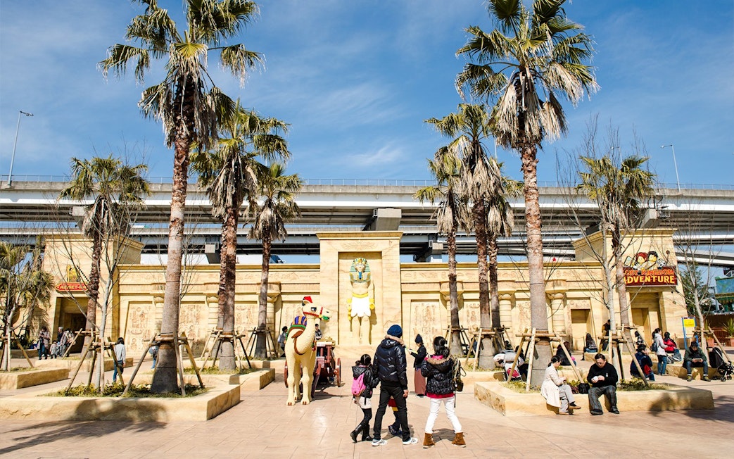 Legoland Japan entrance with Egyptian-themed decor and visitors exploring.