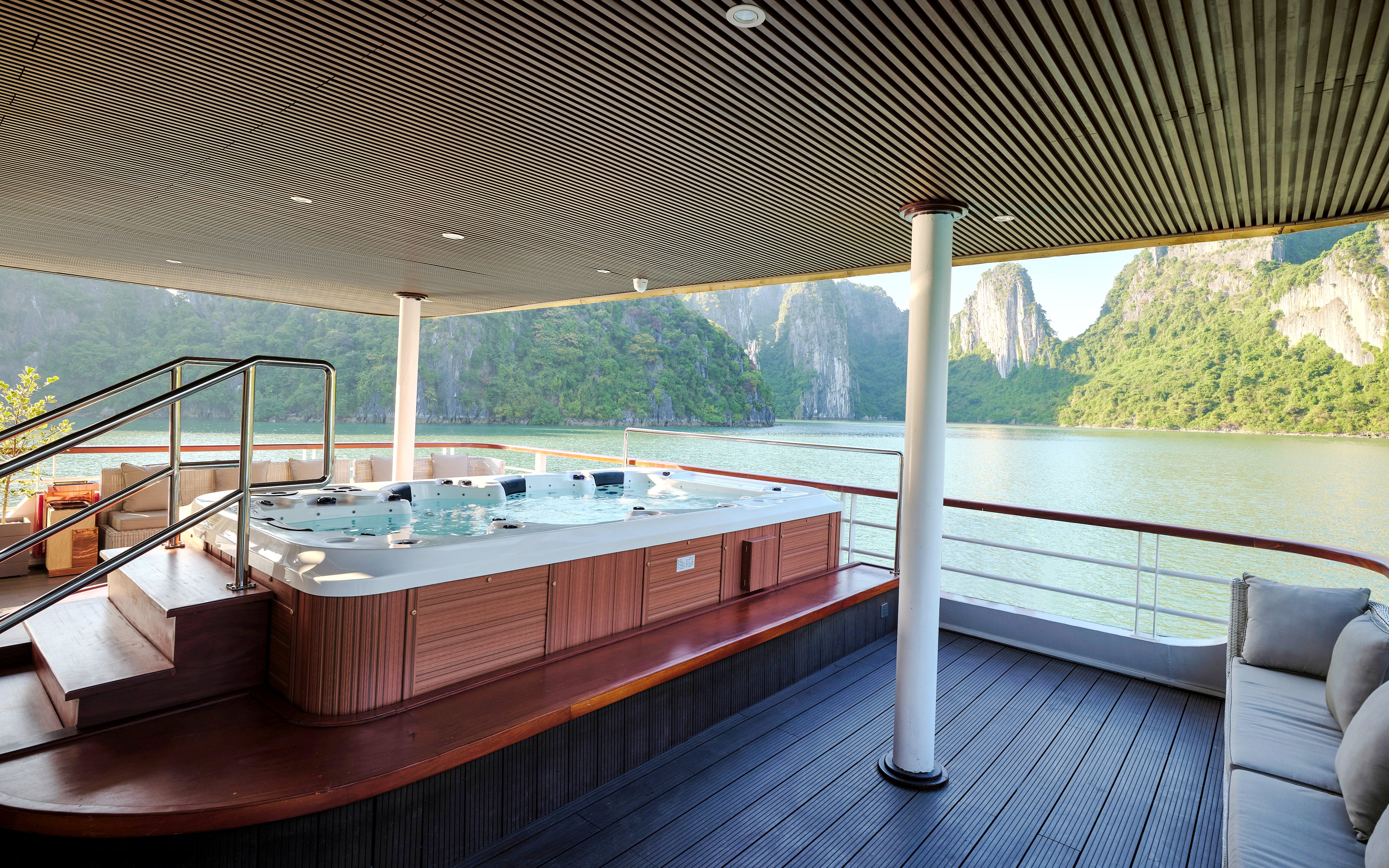 Jacuzzi on Iris Luxury Cruise with Ha Long Bay view at night.