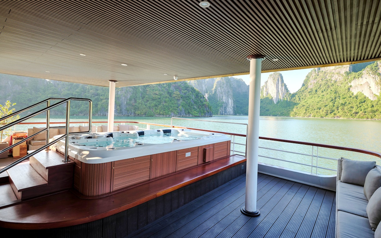 Jacuzzi on Iris Luxury Cruise with Ha Long Bay view at night.