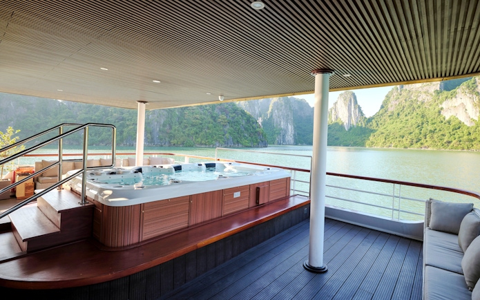Jacuzzi on Iris Luxury Cruise with Ha Long Bay view at night.