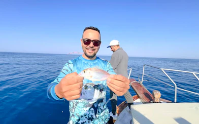 From Side: Open-Sea Fishing Trip with Hotel Transfers