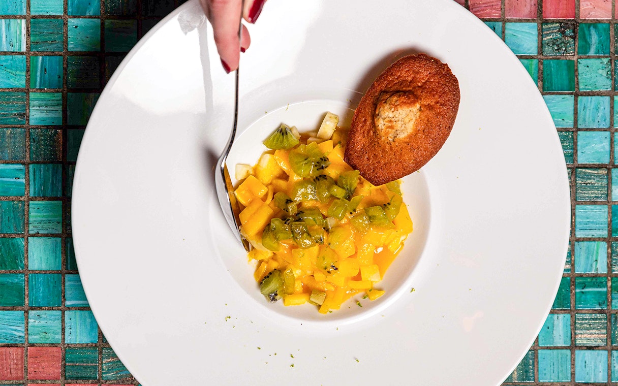 Tropical fruit dessert with madeleine at Opéra-Grand Café Capucines, Paris.