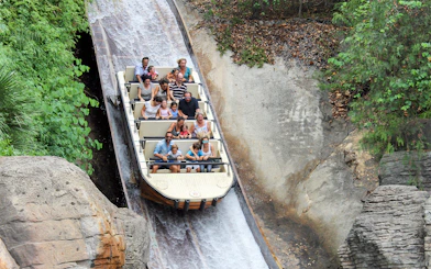 Visitors enjoying a log flume ride at Isla Mágica, Seville.