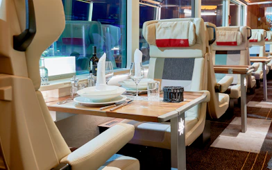 Luxurious dining setup inside Glacier Express train, Switzerland.