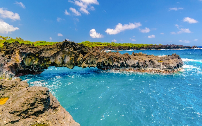 Rocky coastline and ocean view on the Road to Hana, Maui, Hawaii.