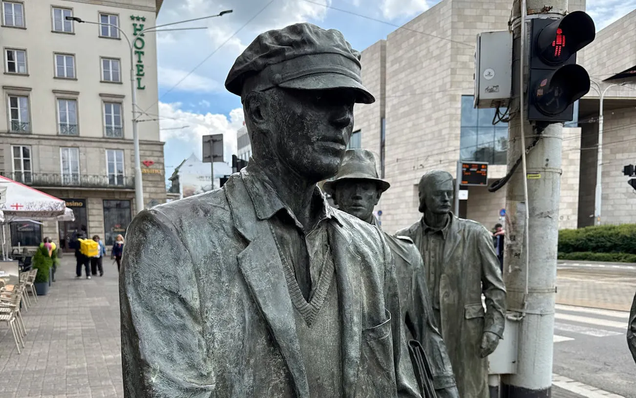 Statues of pedestrians at Wroclaw's Passage, part of the Old Breslau city exploration game.