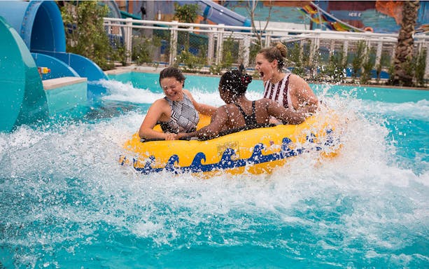 Visitors enjoying a water ride at Laguna Waterpark, Dubai.