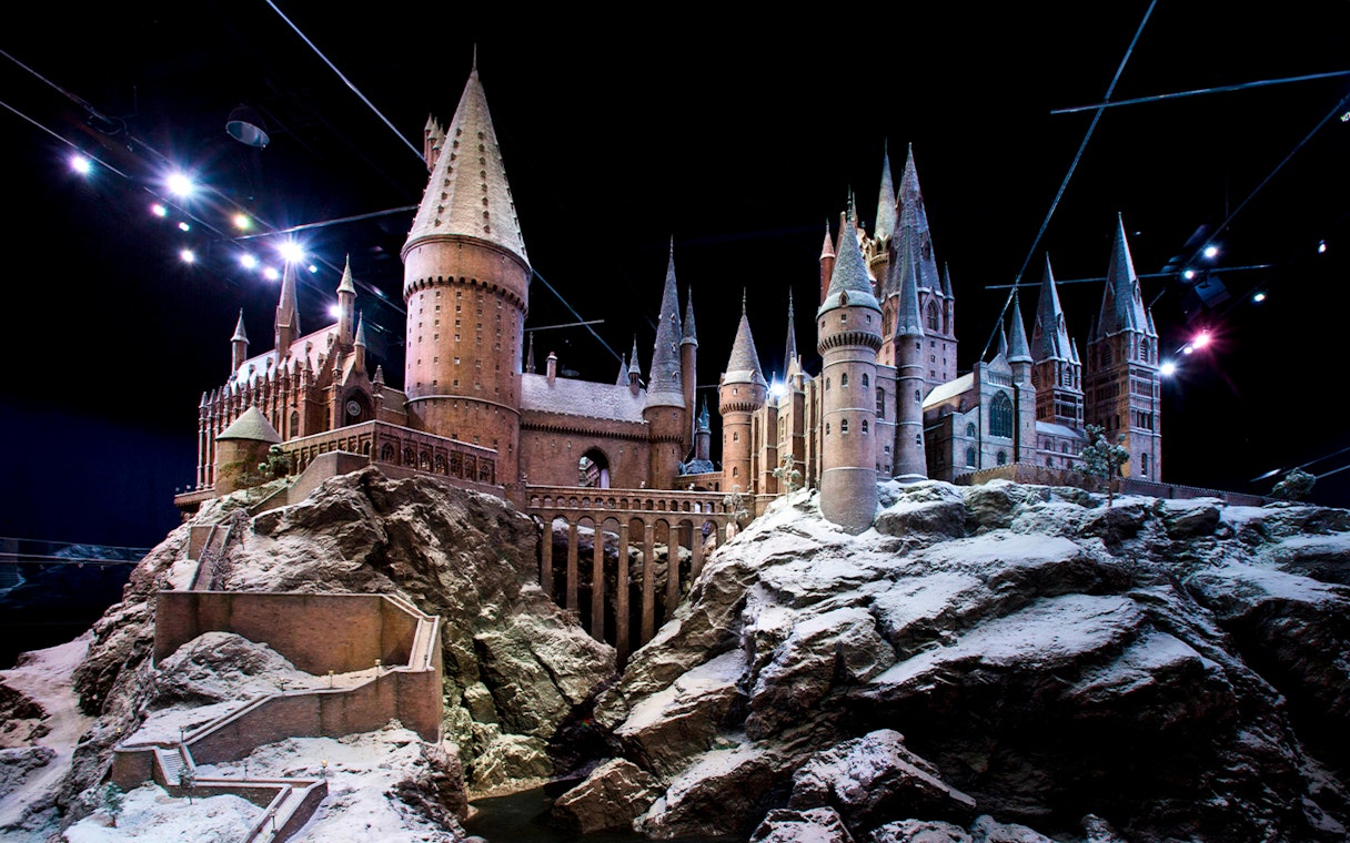 Hogwarts castle model covered in snow, showcasing Christmas at Hogwarts.