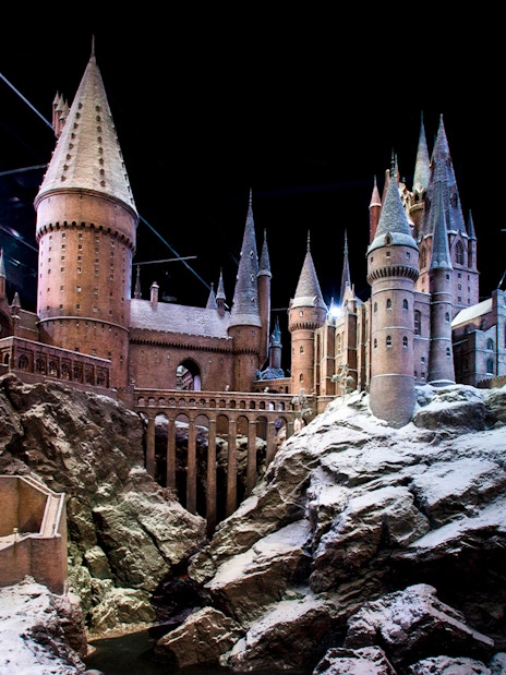 Hogwarts castle model covered in snow, showcasing Christmas at Hogwarts.