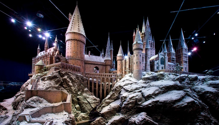 Hogwarts castle model covered in snow, showcasing Christmas at Hogwarts.