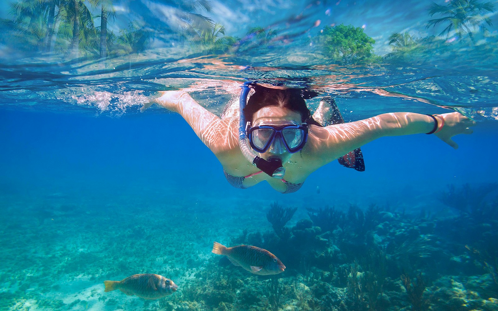 Girl snorkeling in Blue Lagoon