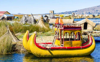 Traditional reed boat on Lake Titicaca near Uros Islands, Puno.