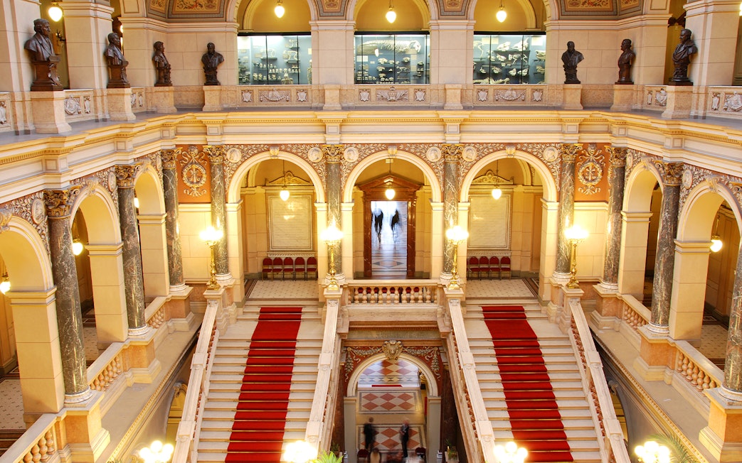 Grand staircase and ornate arches inside the National Prague Museum.