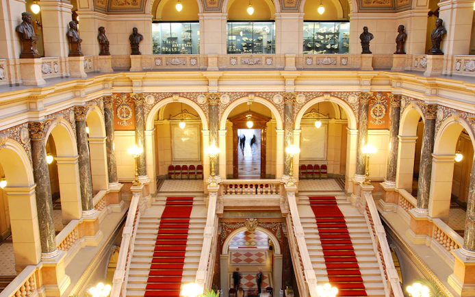 Grand staircase and ornate arches inside the National Prague Museum.