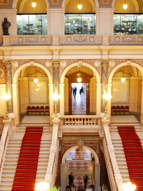 Grand staircase and ornate arches inside the National Prague Museum.