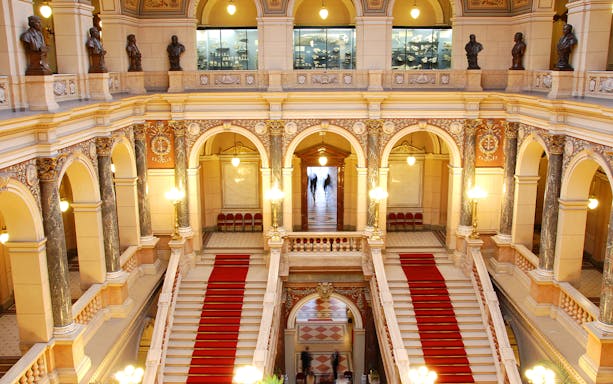 Grand staircase and ornate arches inside the National Prague Museum.