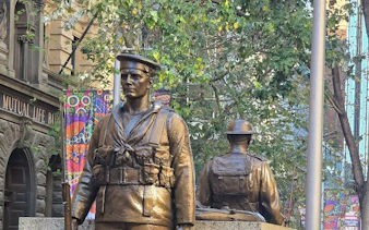Statues of soldiers in Sydney's Queen Victoria Building area, part of the self-guided city exploration game.
