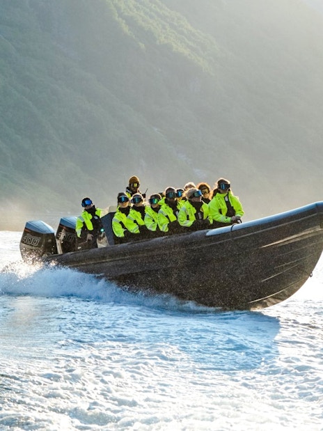 RIB boat with passengers on Geiranger Fjord safari.