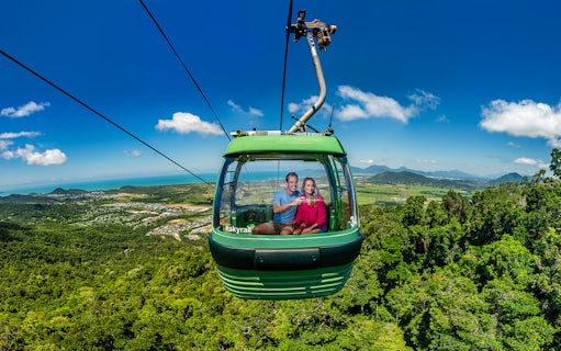 People enjoying the view from a cable car on the Kuranda Skyrail Rainforest Cableway.