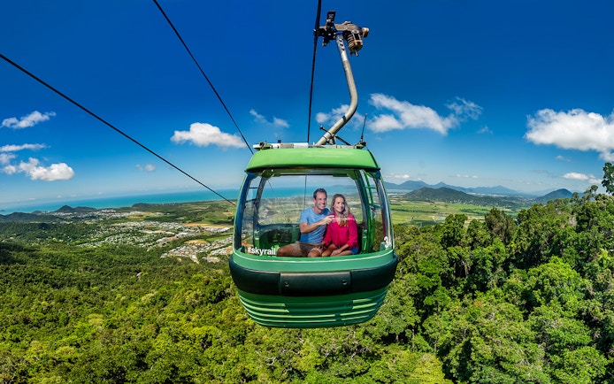 People enjoying the view from a cable car on the Kuranda Skyrail Rainforest Cableway.