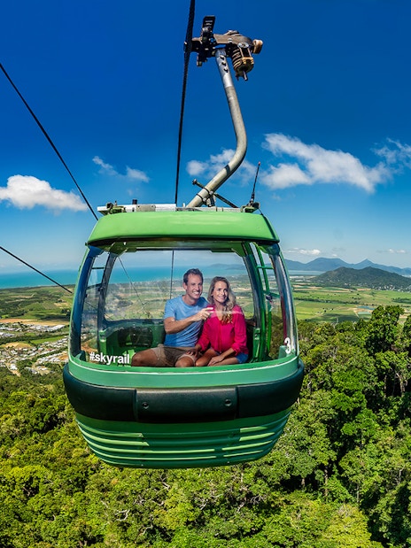 People enjoying the view from a cable car on the Kuranda Skyrail Rainforest Cableway.