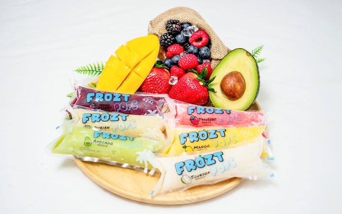 Frozt popsicles with assorted fruits on a wooden plate, Singapore Cable Car Sky Pass.