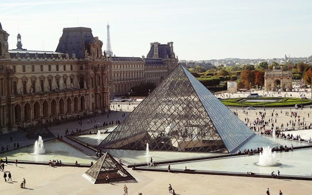 Louvre Pyramid and courtyard in Paris during a full-day VIP private tour.