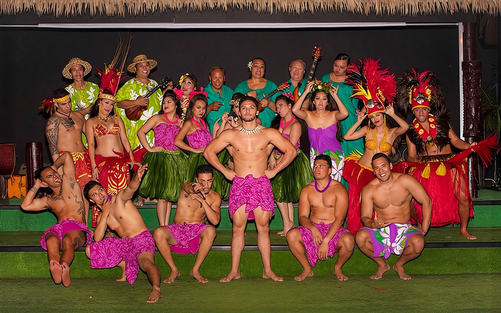 Performers in traditional Hawaiian attire at Paradise Cove Luau, Hawaii.