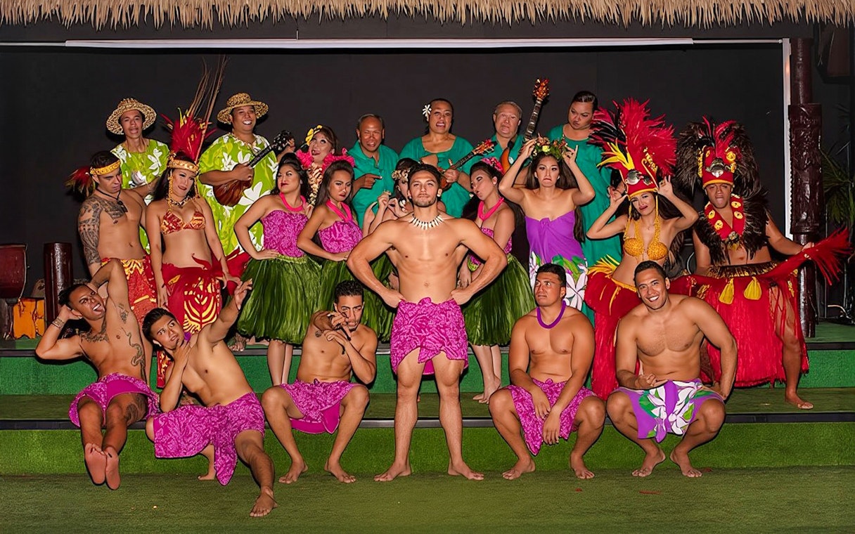 Performers in traditional Hawaiian attire at Paradise Cove Luau, Hawaii.