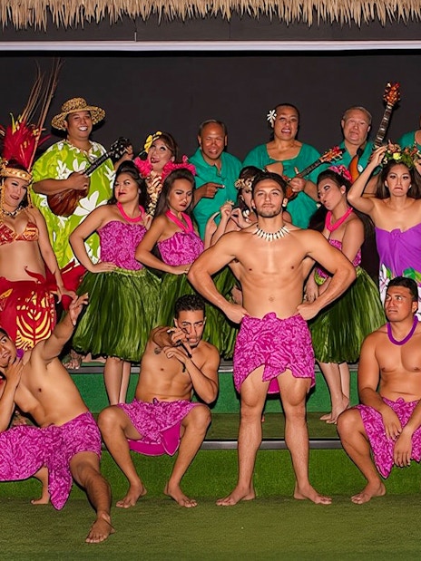 Performers in traditional Hawaiian attire at Paradise Cove Luau, Hawaii.