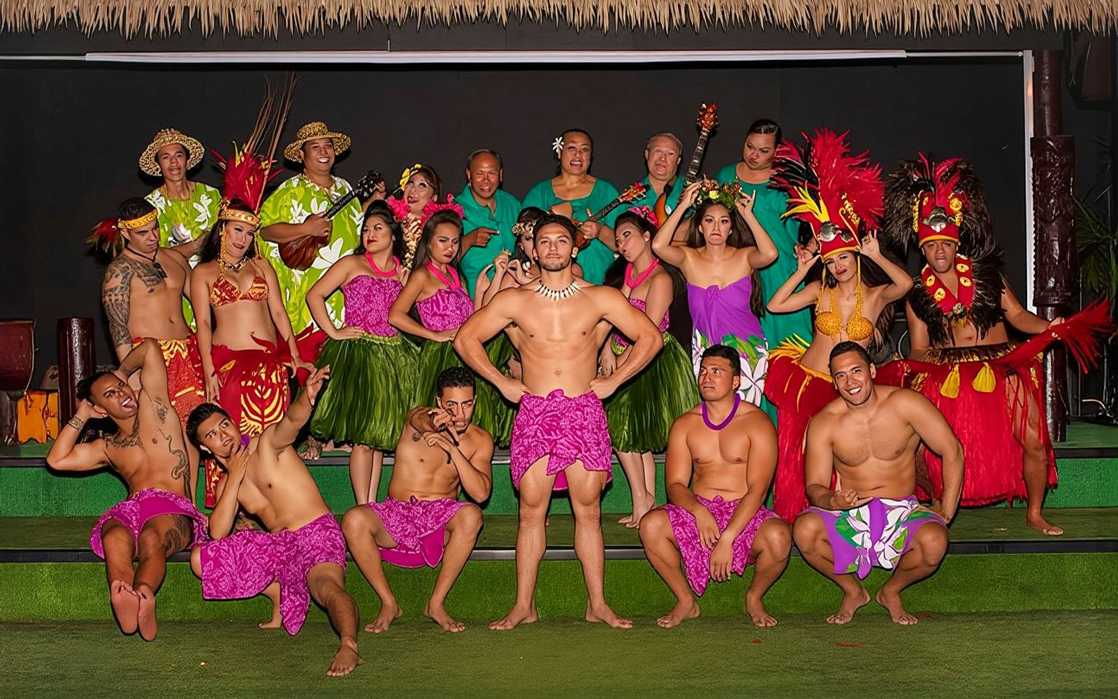Performers in traditional Hawaiian attire at Paradise Cove Luau, Hawaii.