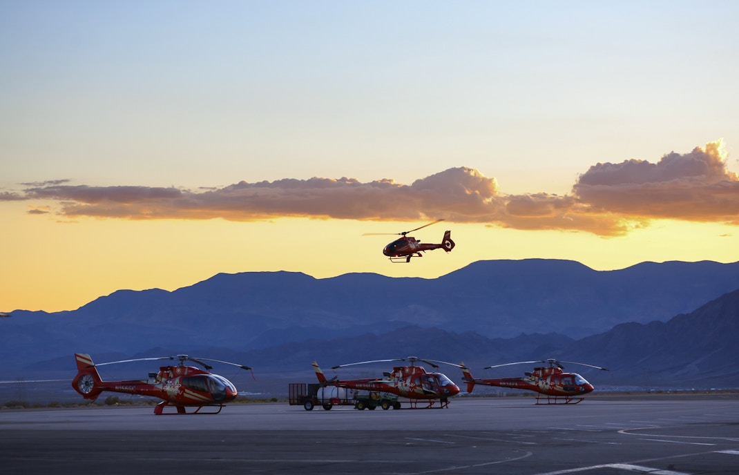 Helicopter landing on Grand Canyon West Rim floor during tour from Las Vegas.