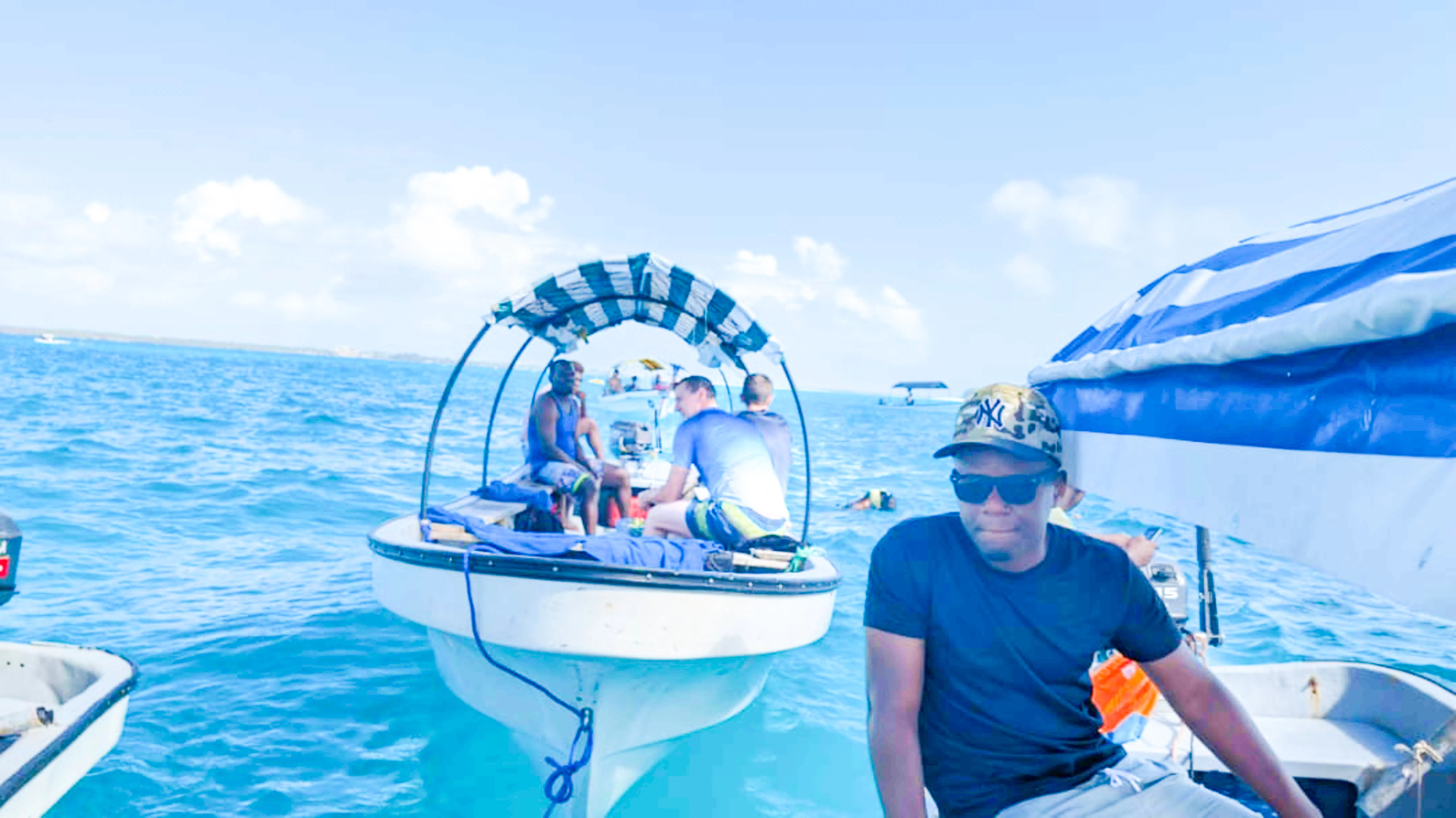 Fishing boats with tourists on a local fishing adventure in Zanzibar waters.