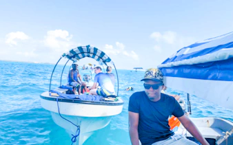 Fishing boats with tourists on a local fishing adventure in Zanzibar waters.