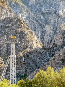 Palm Springs Aerial Tramway ascending rugged mountain landscape.