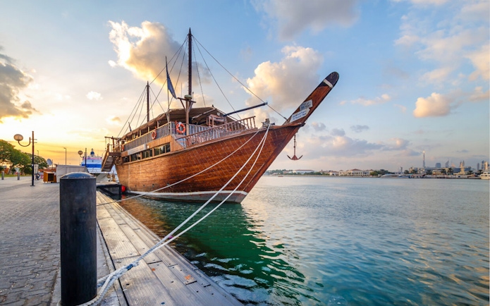 Dhow boat docked at sunset in Dubai Creek, Dubai.