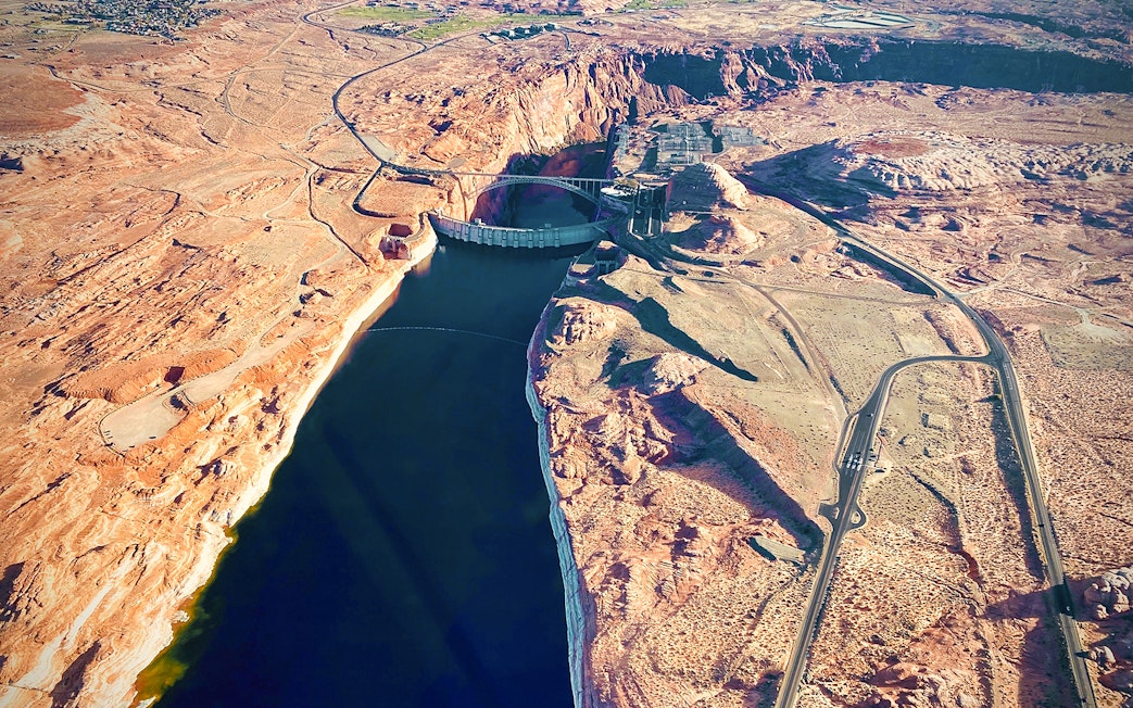 Aerial view of Glen Canyon Dam and Colorado River near Horseshoe Bend, Arizona.