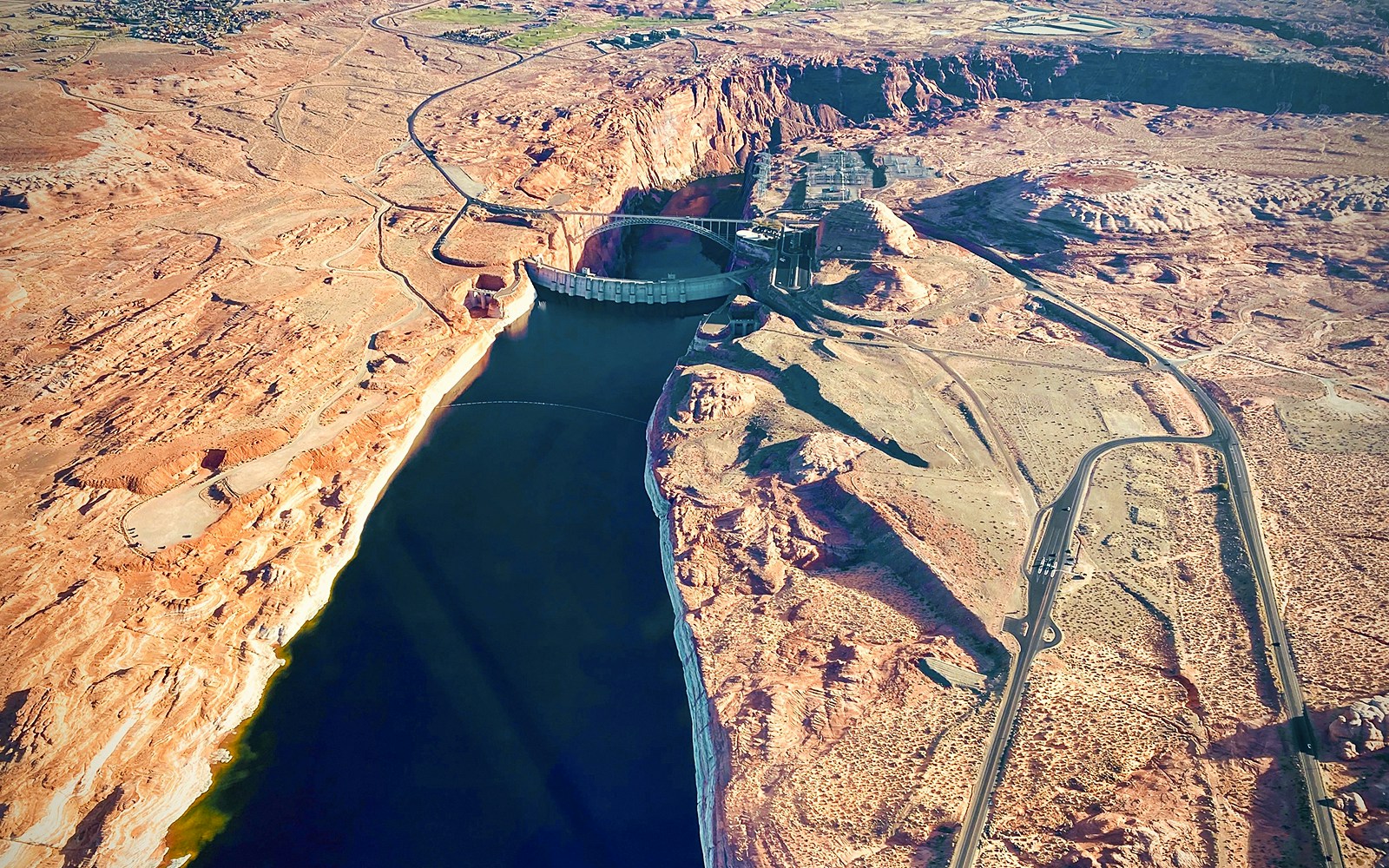 Aerial view of Glen Canyon Dam and Colorado River near Horseshoe Bend, Arizona.