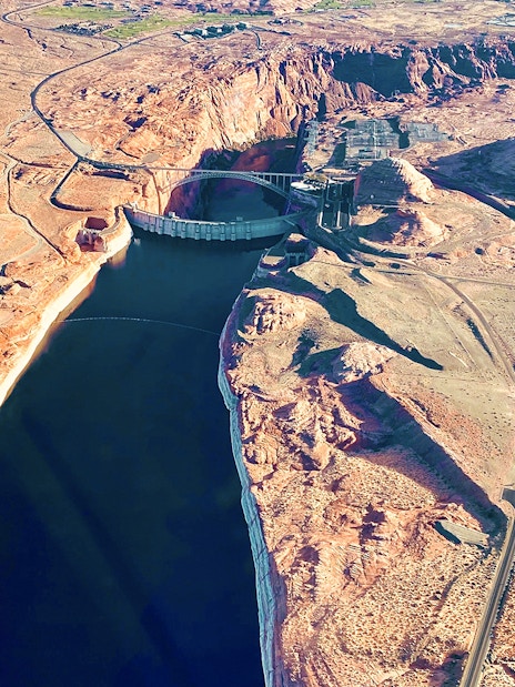 Aerial view of Glen Canyon Dam and Colorado River near Horseshoe Bend, Arizona.