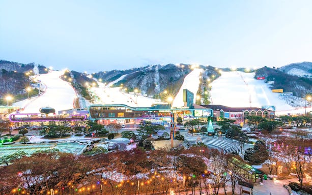 Vivaldi Park Ski World slopes and facilities illuminated at dusk.