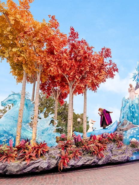 Disneyland Park parade float with Frozen characters and ice-themed decorations in California.
