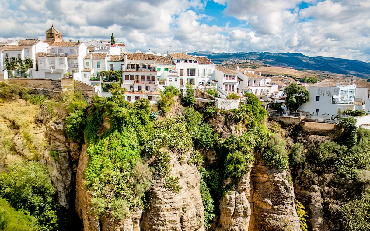 Cliffside houses in Ronda, Spain, perched on the edge of El Tajo gorge.