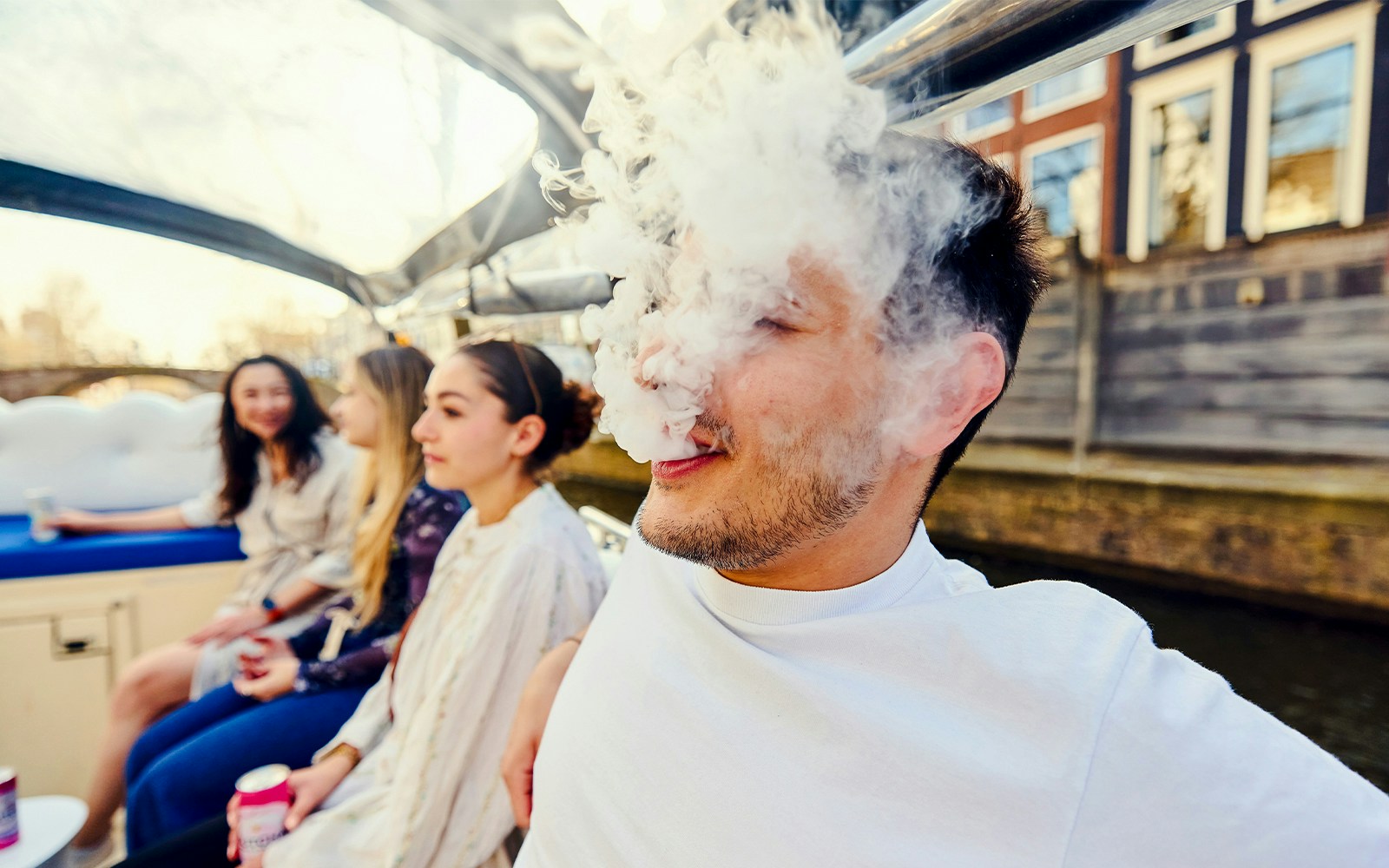 Guests enjoying the Cloud Boat Cruise with canal view.