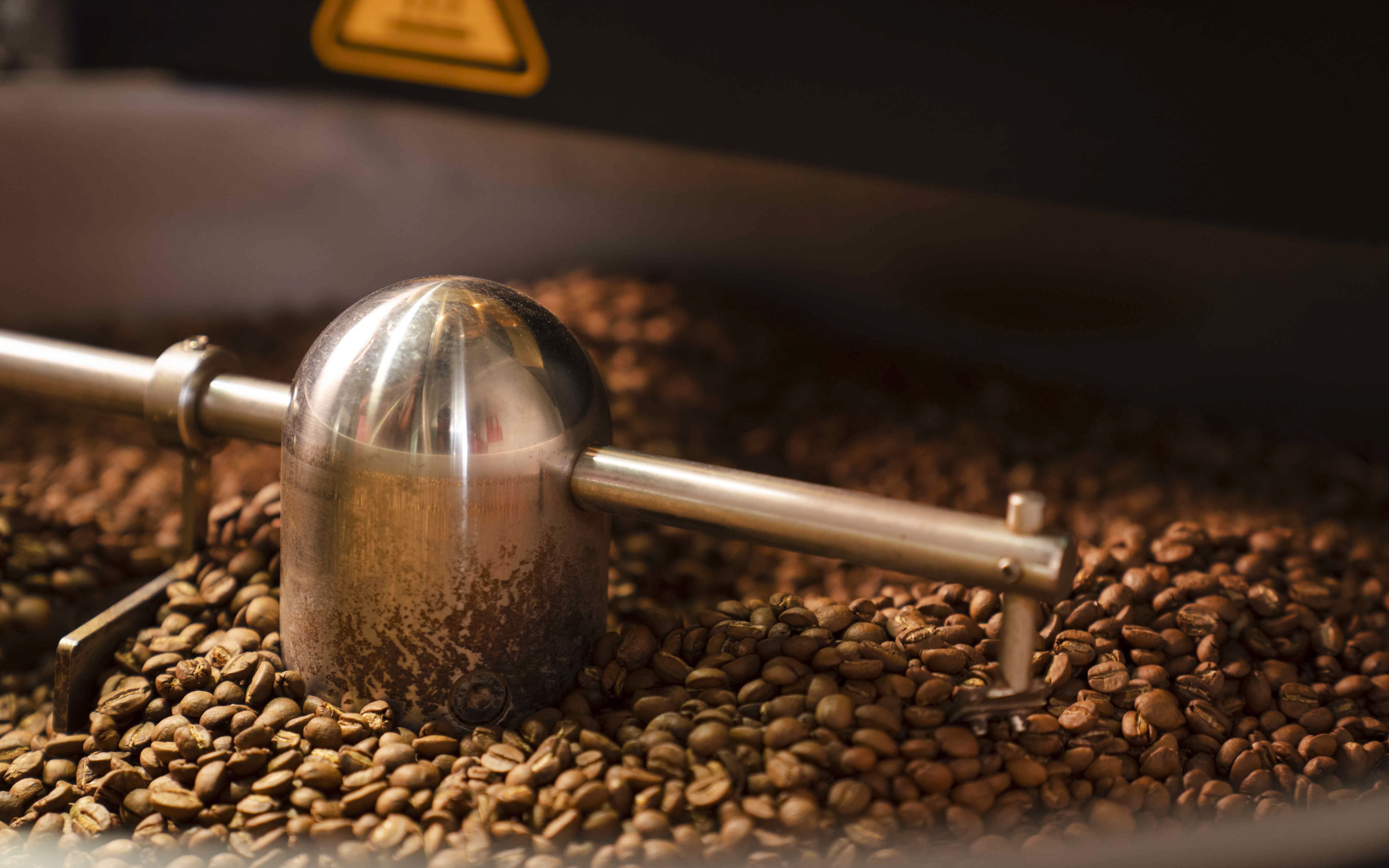 Coffee beans being ground in Chamarel, Mauritius.
