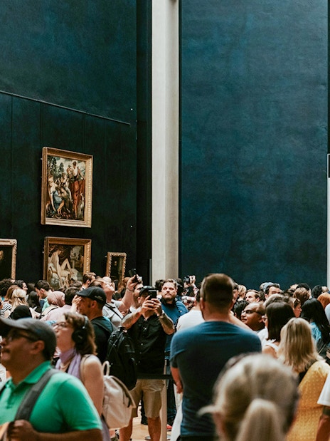 Crowd viewing the Mona Lisa at the Louvre Museum in Paris.