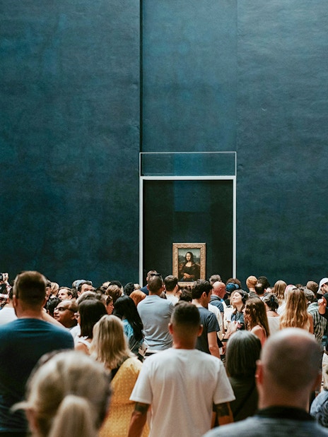 Crowd viewing the Mona Lisa at the Louvre Museum in Paris.