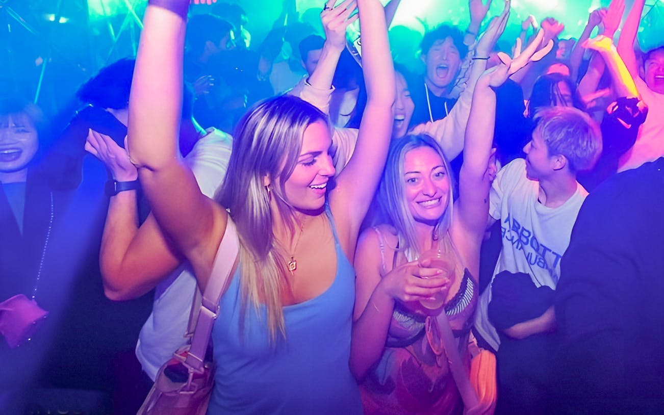 People dancing and enjoying nightlife at KITSUNE Kyoto Nightclub.