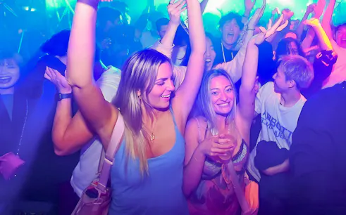 People dancing and enjoying nightlife at KITSUNE Kyoto Nightclub.